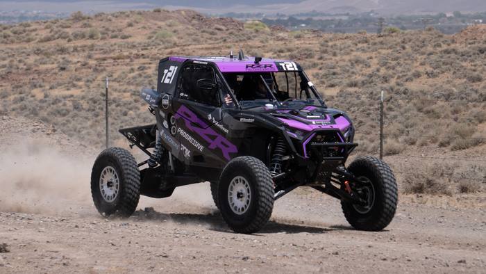 UTV Pro race vehicle number T21 at speed, Polaris RZR