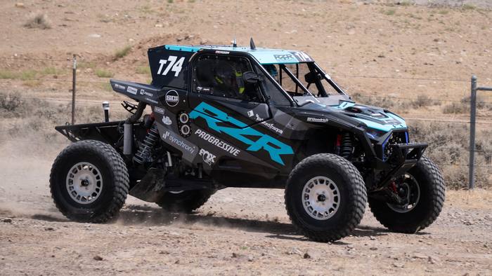 UTV Pro race vehicle number T74 at speed, Polaris RZR