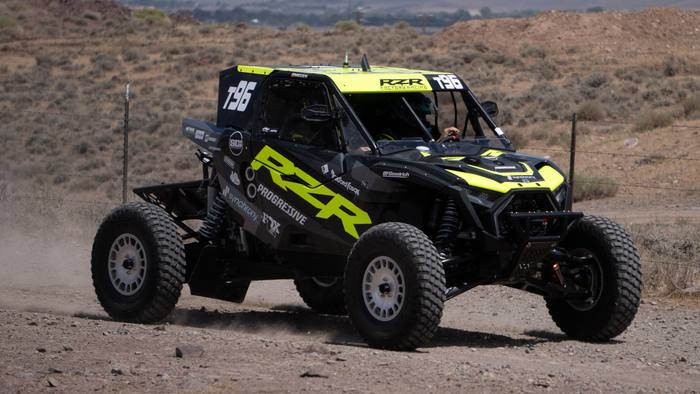UTV Pro race vehicle number T96 at speed, Polaris RZR