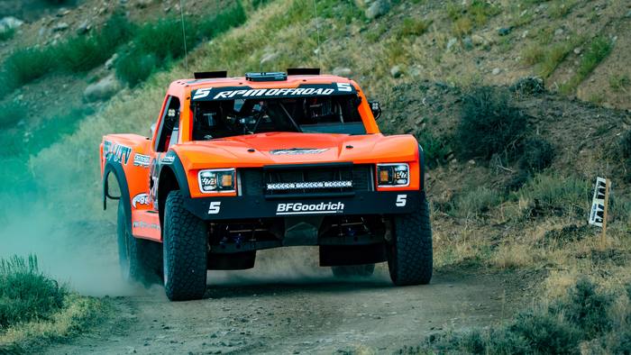 Unlimited Truck (4WD) race vehicle number 5 at speed, Robby Gordon