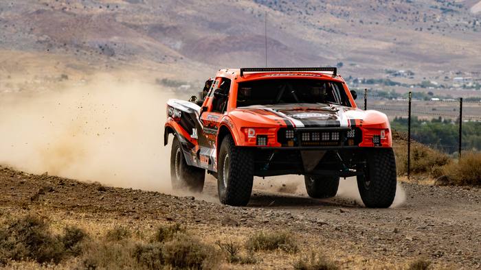 Unlimited Truck (2WD) race vehicle number 50 at speed, Herling Racing