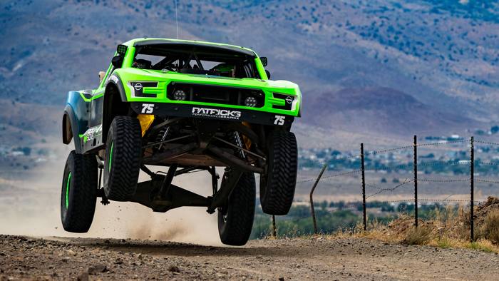 Unlimited Truck (2WD) race vehicle number 75 at speed, Jordan Dean