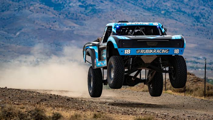 Unlimited Truck (2WD) race vehicle number 18 at speed, Nic Whetstone