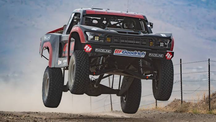 Unlimited Truck (2WD) race vehicle number 82 at speed, JP Gomez