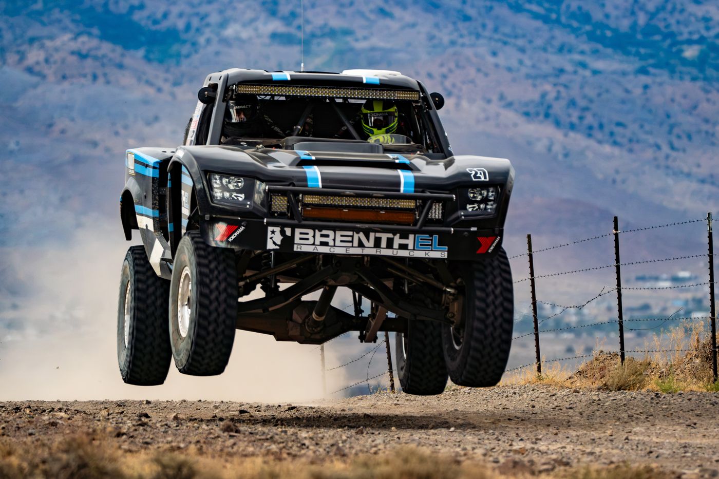 Unlimited Truck (4WD) race vehicle number 27 at speed, Jonathan Brenthel